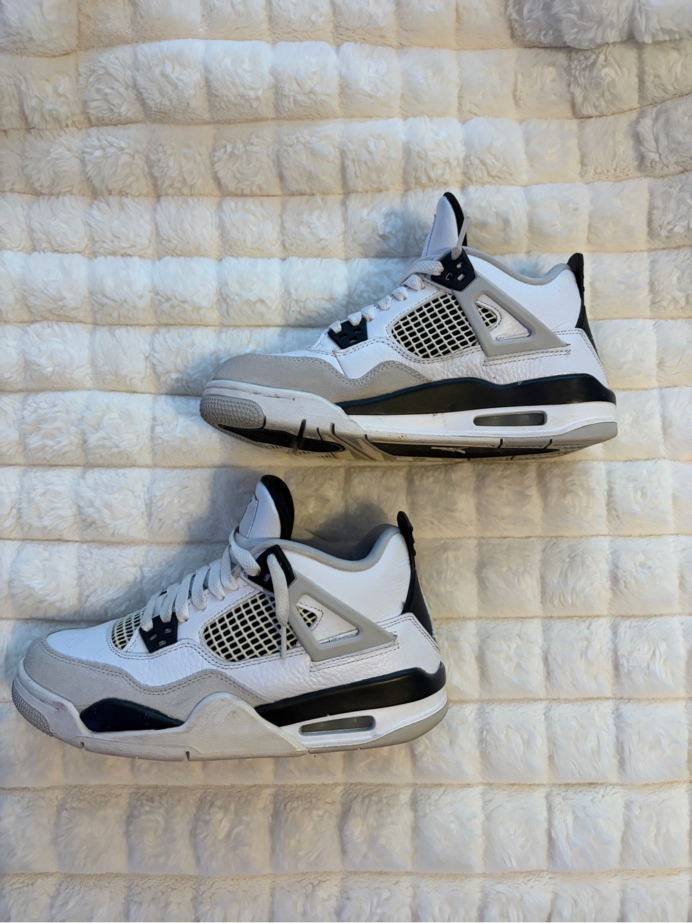 Size 7 women’s Jordan 4 White and Black sneakers